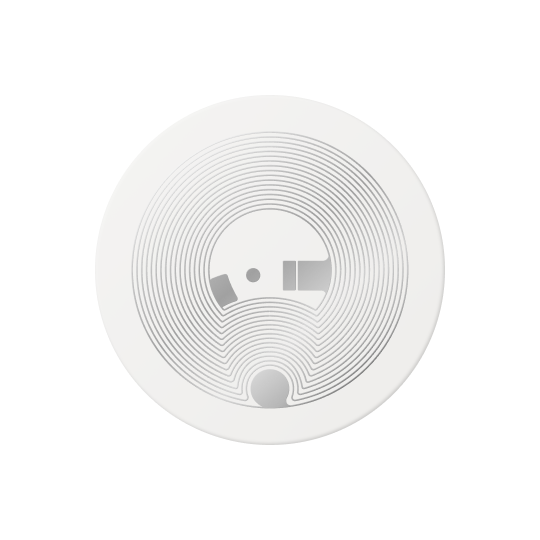 A round garment tag in translucent white, its coil showing through the face
