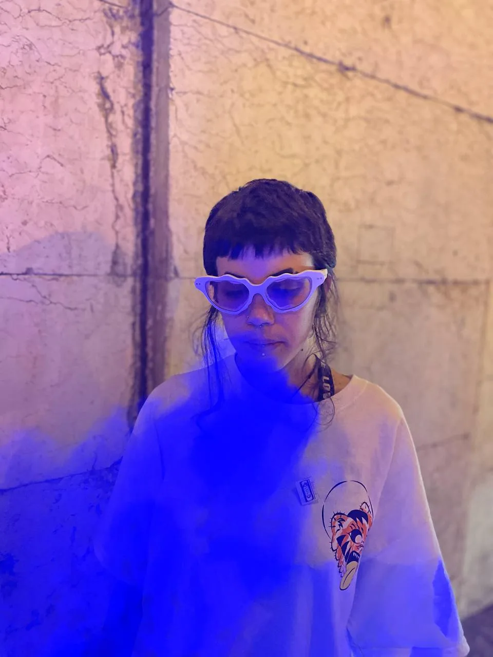 Cat eye frames, through blue smoke