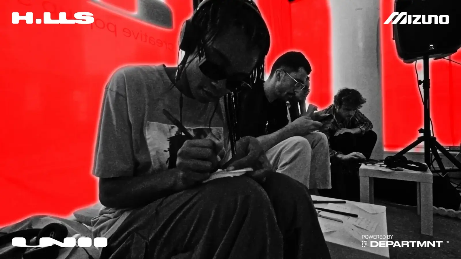 Listening experience II, Mizuno at UNII: headphones on, in front of the red