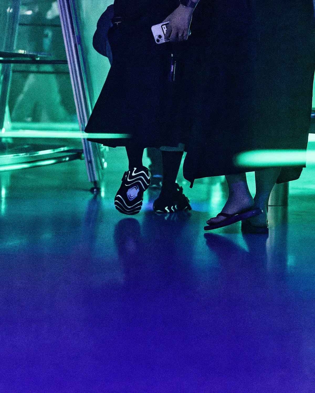 The soles, glowing, on the blue floor