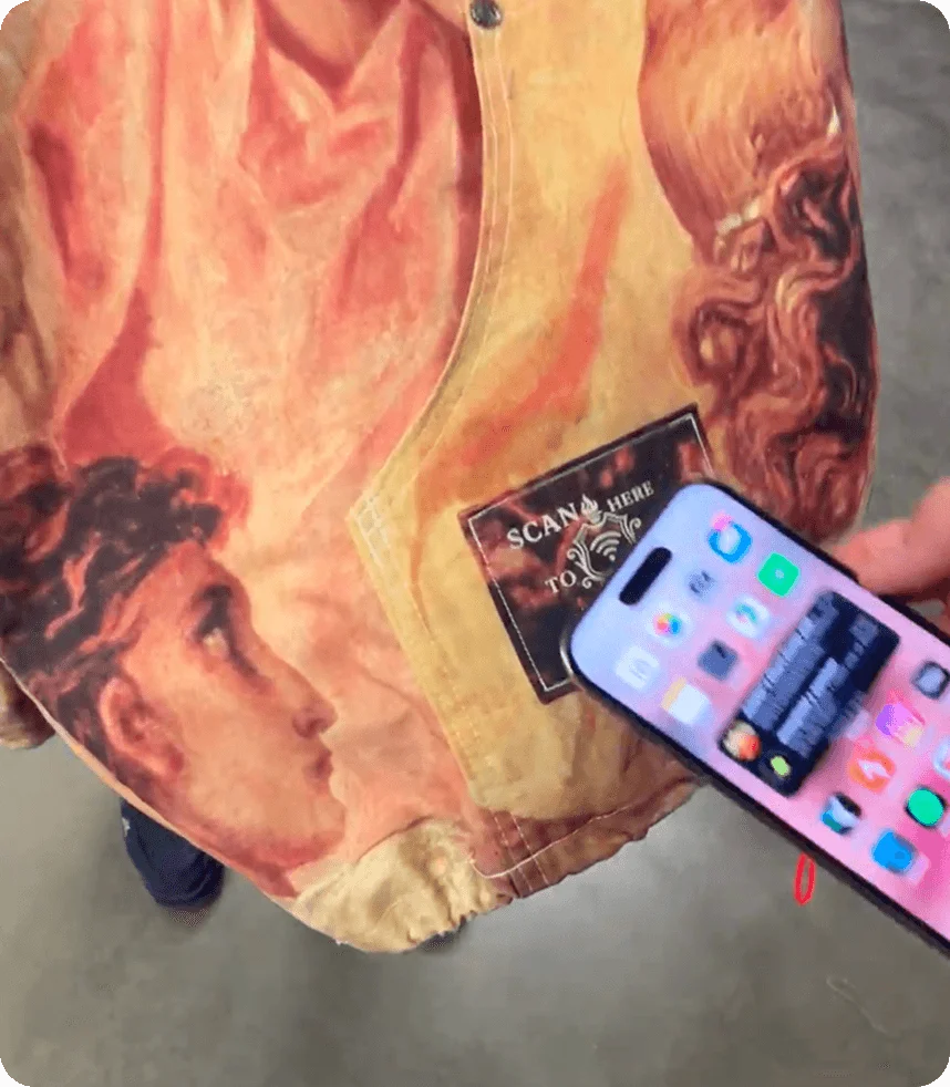 The Renaissance bomber, its patch tapped with a phone