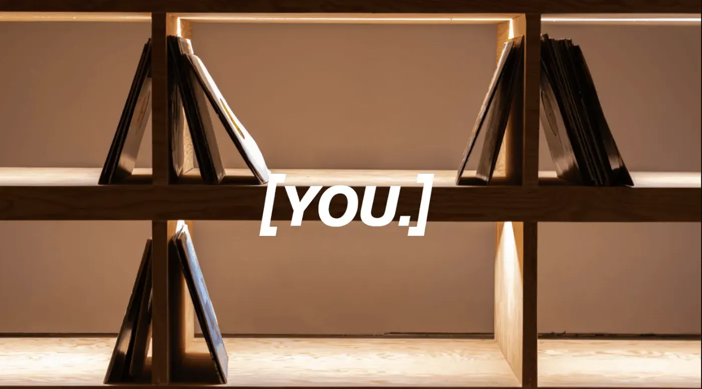 YOU Studio shelving with the YOU mark